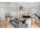 Spacious open-concept living room flows to the kitchen and dining area, filled with natural light at 910 Everett Pl, Charlotte, NC 28205