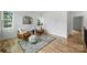 Sitting room with a geometric rug, modern chairs, and natural light from the windows at 910 Everett Pl, Charlotte, NC 28205