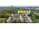 Aerial view of townhome community with mature trees and Charlotte skyline at 926 Steel House Blvd, Charlotte, NC 28205