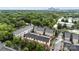 An aerial view showcasing the townhome community surrounded by green trees at 926 Steel House Blvd, Charlotte, NC 28205