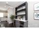 Elegant bar area features custom shelving, wine cooler, and marble countertop, perfect for entertaining at 926 Steel House Blvd, Charlotte, NC 28205