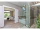 Modern bathroom featuring a glass shower, soaking tub, tile floors, and a view into the connected bedroom at 926 Steel House Blvd, Charlotte, NC 28205