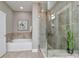 Bright bathroom featuring a glass enclosed shower, soaking tub, and modern finishes at 926 Steel House Blvd, Charlotte, NC 28205