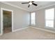 Well-lit bedroom featuring neutral walls, carpet, two windows and a shower at 926 Steel House Blvd, Charlotte, NC 28205