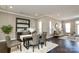 Open-concept dining room with bar area, dark wood floors and natural light at 926 Steel House Blvd, Charlotte, NC 28205