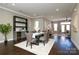 Beautiful dining room with adjacent wet bar and an open view to the living room and the rest of the house at 926 Steel House Blvd, Charlotte, NC 28205