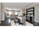 Open-concept dining area showcases a modern table, stylish chairs, and convenient access to the kitchen and bar at 926 Steel House Blvd, Charlotte, NC 28205