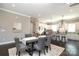 Dining room with kitchen in the background showing white cabinets, stainless appliances and a breakfast bar at 926 Steel House Blvd, Charlotte, NC 28205