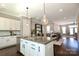Open kitchen view includes granite counters, modern appliances, breakfast bar, and seamless transition to living spaces at 926 Steel House Blvd, Charlotte, NC 28205