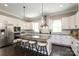 Well-equipped kitchen with stainless appliances, center island, and granite countertops is perfect for culinary adventures at 926 Steel House Blvd, Charlotte, NC 28205