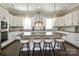 Stylish kitchen boasts an island with seating, modern lighting, and ample counter space at 926 Steel House Blvd, Charlotte, NC 28205