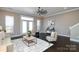 Bright living room featuring a ceiling fan, neutral decor, and access to the outdoors at 926 Steel House Blvd, Charlotte, NC 28205