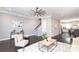 Living room with dark wood floors, neutral decor and access to the kitchen and stairway at 926 Steel House Blvd, Charlotte, NC 28205