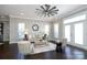 Living room featuring a ceiling fan, neutral decor, and French doors at 926 Steel House Blvd, Charlotte, NC 28205