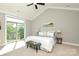 Bright main bedroom featuring a vaulted ceiling, private balcony, and comfortable furnishings at 926 Steel House Blvd, Charlotte, NC 28205