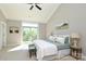 Bright main bedroom featuring a vaulted ceiling, private balcony, and comfortable furnishings at 926 Steel House Blvd, Charlotte, NC 28205