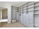 Organized walk-in closet featuring built-in shelving and drawer systems to maximize space at 926 Steel House Blvd, Charlotte, NC 28205