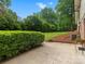 A beautiful backyard with lush green grass, hedges, and patio area at 981 Meadowlark Dr, Rock Hill, SC 29732