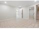 Finished basement space with tile flooring and access to stairs at 981 Meadowlark Dr, Rock Hill, SC 29732