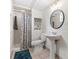Full bathroom with a pedestal sink, stand up shower, and decorative mirror at 981 Meadowlark Dr, Rock Hill, SC 29732