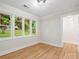 Cozy bedroom with hardwood floors, crown molding, and large windows providing natural light at 981 Meadowlark Dr, Rock Hill, SC 29732