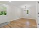 Well-lit dining room with hardwood floors and an exterior door, offering a welcoming space at 981 Meadowlark Dr, Rock Hill, SC 29732