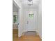 Bright foyer featuring hardwood floors, white trim, and a stylish front door with glass inserts at 981 Meadowlark Dr, Rock Hill, SC 29732
