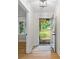 Bright foyer showcasing hardwood floors, white trim, and the front door leading to a well-manicured front yard at 981 Meadowlark Dr, Rock Hill, SC 29732