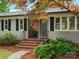 Close-up of a home's front entrance with brick steps, black door and matching shutters at 981 Meadowlark Dr, Rock Hill, SC 29732
