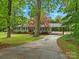 Charming one-story home with well-maintained lawn, covered parking, and mature trees offering shade at 981 Meadowlark Dr, Rock Hill, SC 29732