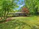 Charming home with a well-maintained front yard and a covered parking area at 981 Meadowlark Dr, Rock Hill, SC 29732