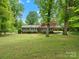 Charming home with a well-maintained front yard and a covered parking area at 981 Meadowlark Dr, Rock Hill, SC 29732