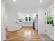 Bright kitchen featuring white cabinetry, a large window, and an open concept design at 981 Meadowlark Dr, Rock Hill, SC 29732