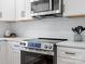 Modern kitchen with stainless steel oven, microwave, and white subway tile backsplash at 981 Meadowlark Dr, Rock Hill, SC 29732