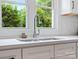 Close up of modern kitchen sink and countertop with a view of greenery outside the window at 981 Meadowlark Dr, Rock Hill, SC 29732