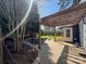 Backyard boasts a large brick patio under a pergola, offering a perfect spot for outdoor dining and relaxation at 1019 Valley St, Kannapolis, NC 28081