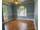 Bright bedroom with hardwood floors, large windows, and a neutral color palette at 1019 Valley St, Kannapolis, NC 28081