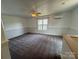 The cozy upstairs bonus room features plush carpet, wainscoting and natural lighting at 1019 Valley St, Kannapolis, NC 28081