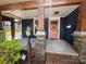 Inviting front porch with stylish accents, stone supports, and colorful landscaping at 1019 Valley St, Kannapolis, NC 28081