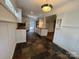 Stylish kitchen featuring custom cabinets, a mosaic backsplash, and durable slate flooring at 1019 Valley St, Kannapolis, NC 28081