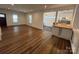 Spacious living room with hardwood floors and great natural light flows into adjacent kitchen at 1019 Valley St, Kannapolis, NC 28081