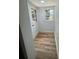 Well-lit mud room entrance includes plank flooring, beadboard trim and glass paneled door at 1019 Valley St, Kannapolis, NC 28081