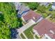 Aerial view of the house with well-manicured lawn, mature trees, and neighborhood setting at 1027 Feather Oak Ln, Matthews, NC 28104