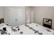 Bright bedroom featuring double closets, ensuite access, and neutral paint scheme at 1027 Feather Oak Ln, Matthews, NC 28104