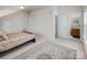 Large bedroom with ensuite bathroom, neutral paint, plush carpet, and decor rug at 1027 Feather Oak Ln, Matthews, NC 28104