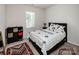 Neat bedroom featuring an area rug, neutral paint, and a window at 1027 Feather Oak Ln, Matthews, NC 28104