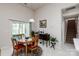 Cozy breakfast nook with a round table, rug, and access to a sliding glass door at 1027 Feather Oak Ln, Matthews, NC 28104