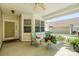 Inviting covered front porch with comfortable seating and potted plants by the front door at 1027 Feather Oak Ln, Matthews, NC 28104