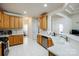 Well-lit kitchen with white tile floor, white countertop, and stainless steel appliances at 1027 Feather Oak Ln, Matthews, NC 28104