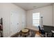 Office room showcasing ample light, hardwood floors, and a neutral color palette at 1027 Feather Oak Ln, Matthews, NC 28104
